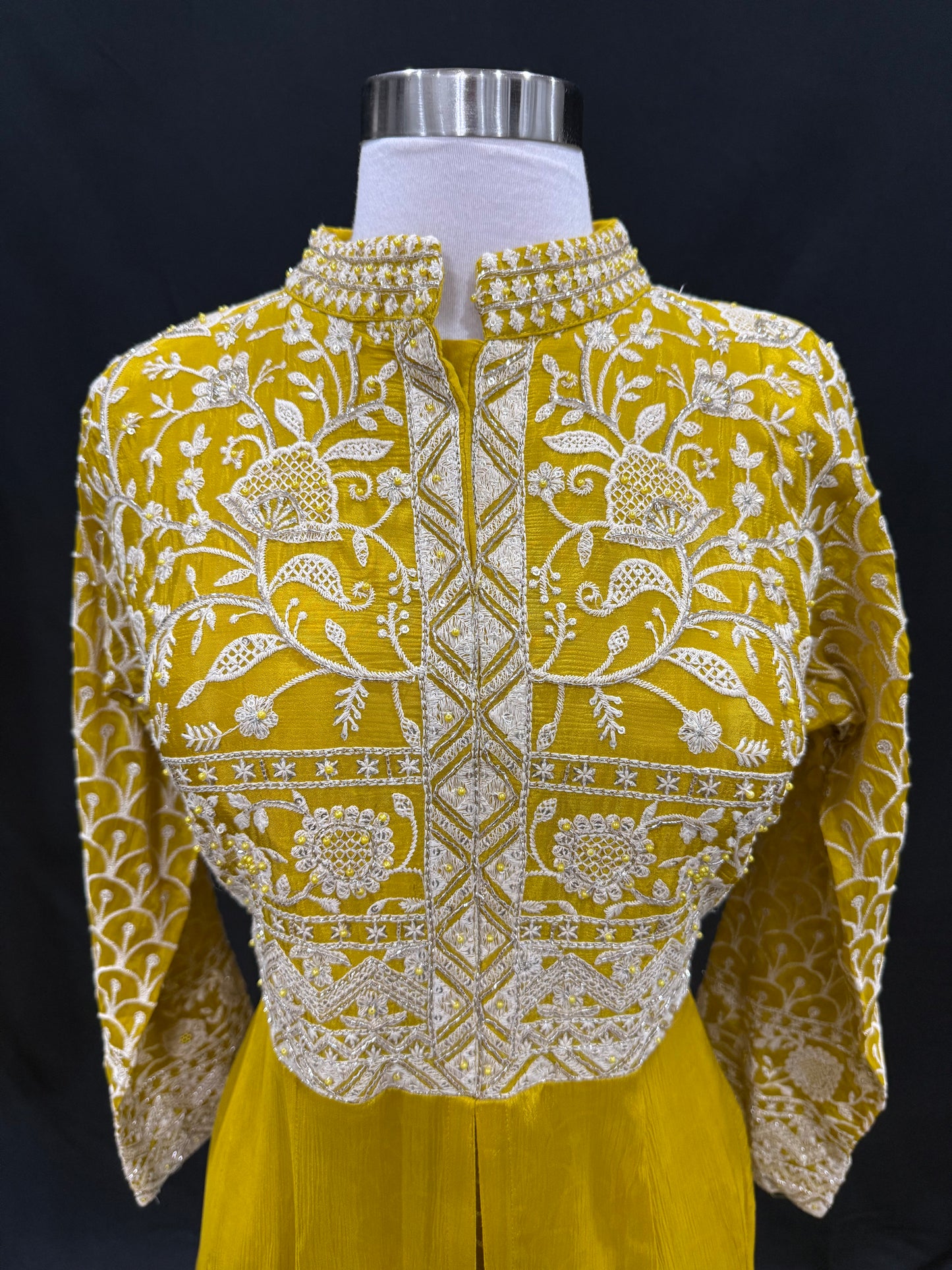 Step into elegance with this stunning mustard yellow Anarkali suit, featuring intricate thread and zari embroidery. Available in size 42.