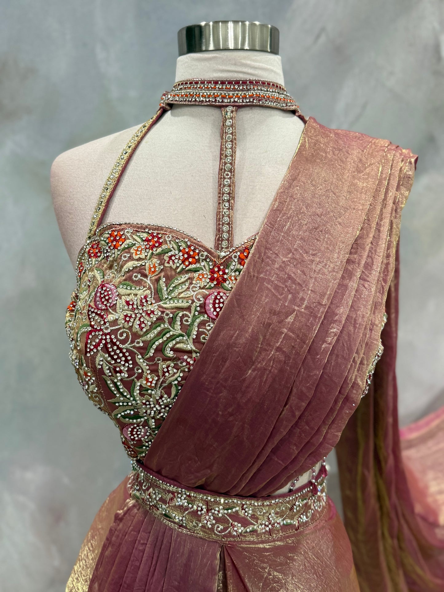 Stunning blush pink Indo-Western drape outfit featuring a beautifully embroidered tube-style blouse adorned with intricate stone, sequin, and zari work