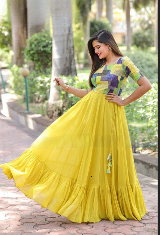 Beautiful yellow gown Fabricated in sequins and georgette fabrics, the Anarkali with ruffles respectively, make a Mint Yellow color combination.