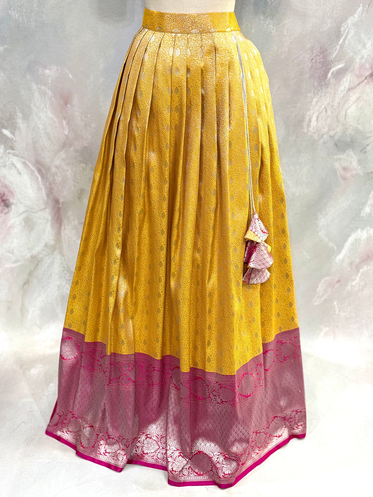 Beautiful Customized Banarasi silk half sarees in yellow and magenta pink hues Maggam work blouses and bead embellishments size 34 to 38