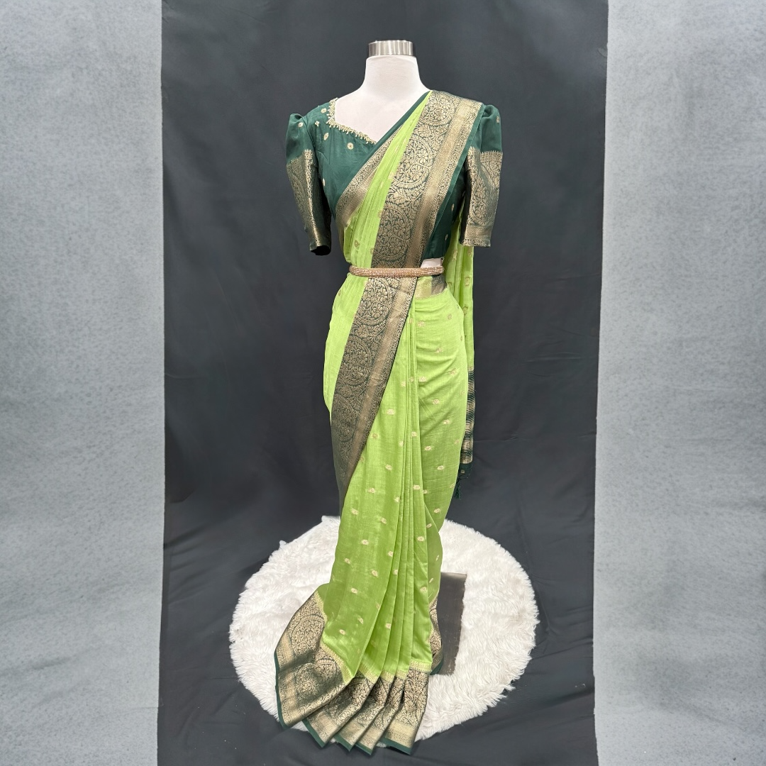 Stunning Green combo Raw Mango silk saree paired with a contrasting pink blouse and Hand work on the blouse. Size 38 upto 42.