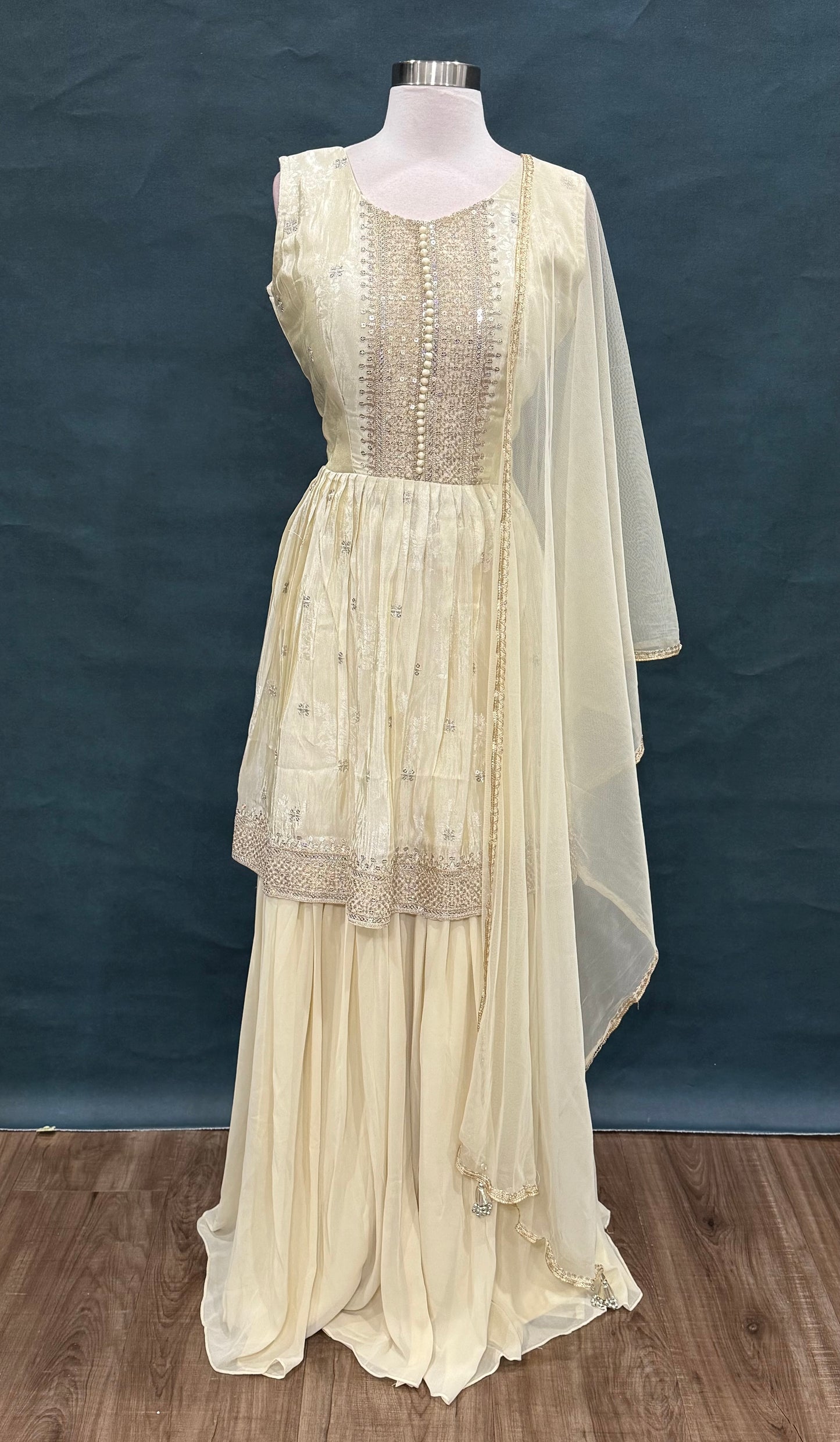 Elegant Off-white gold rich silk sharara set with delicate sequin detailing for that royal glow size 40