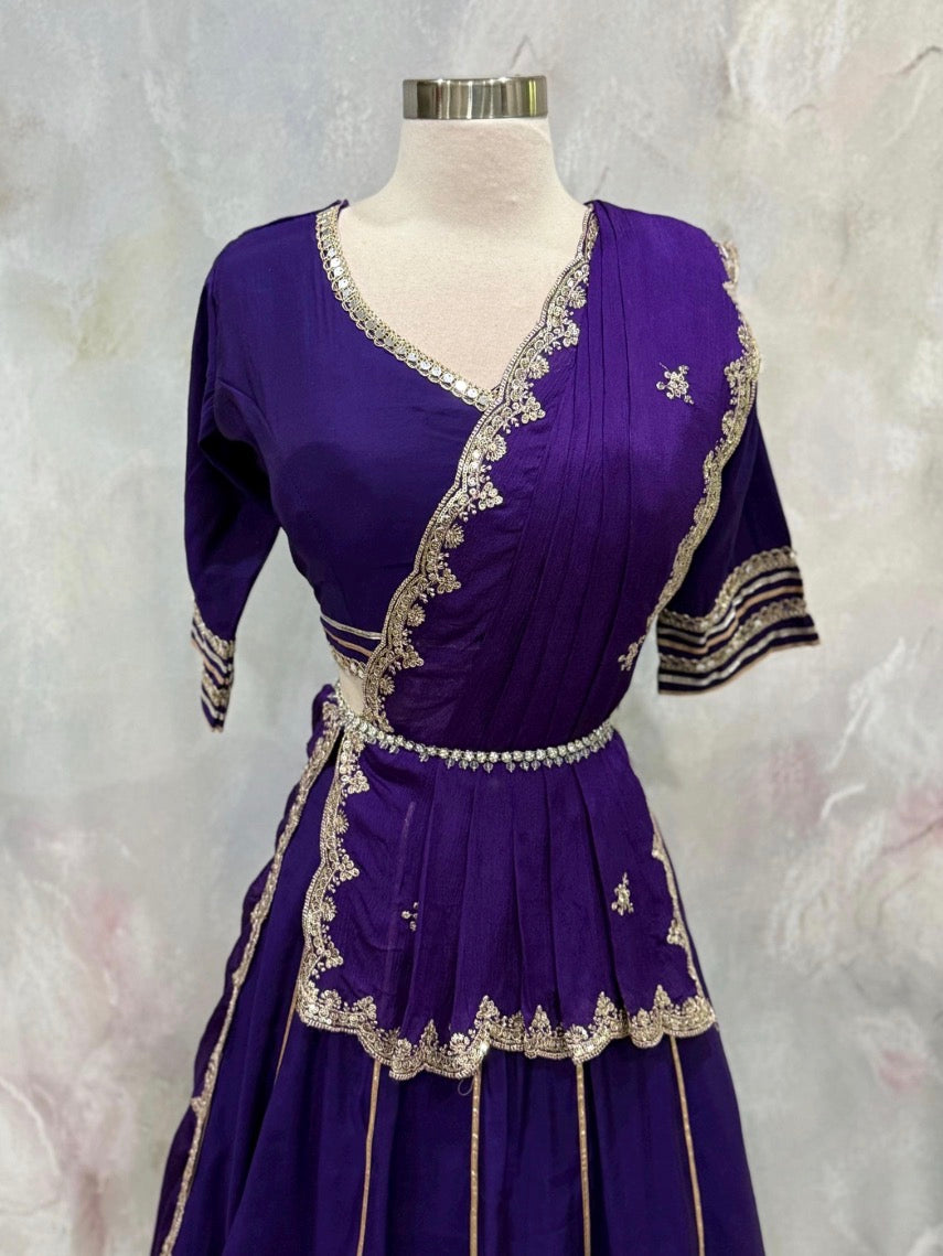 Beautiful purple ensemble with stunning border details. Gorgeous embellished dupatta with the blouse. Available in size 38 to 40