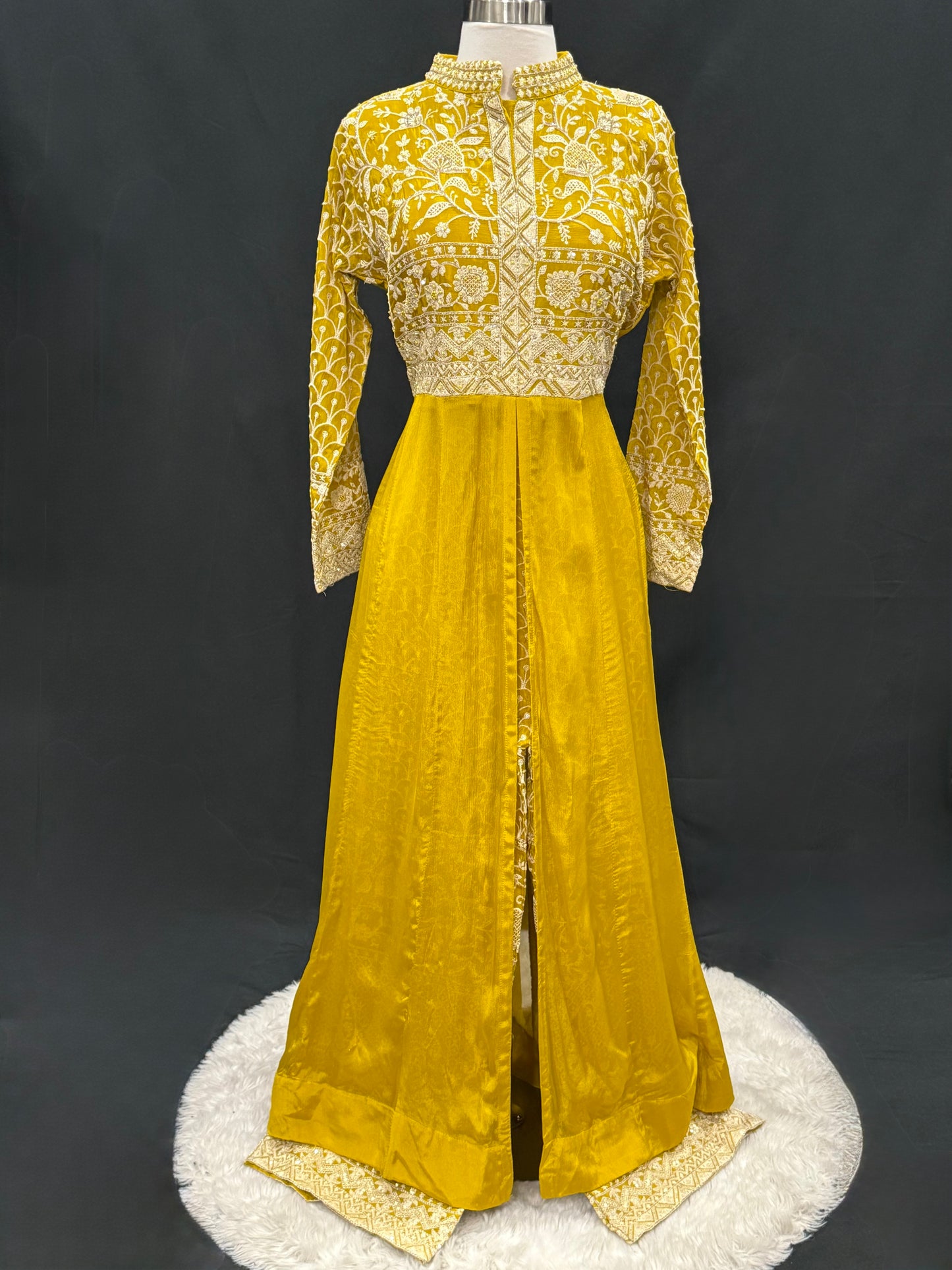 Step into elegance with this stunning mustard yellow Anarkali suit, featuring intricate thread and zari embroidery. Available in size 42.