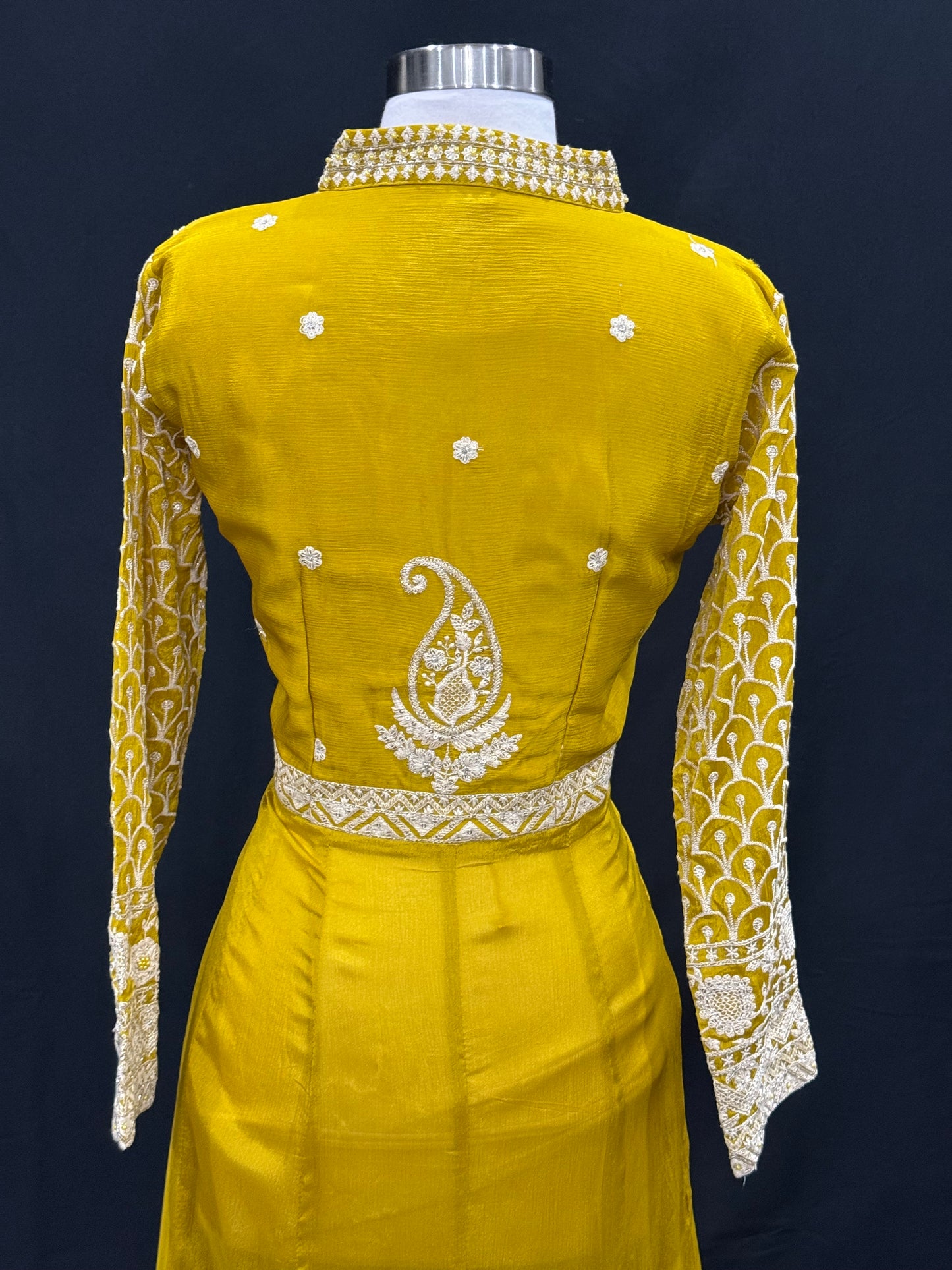 Step into elegance with this stunning mustard yellow Anarkali suit, featuring intricate thread and zari embroidery. Available in size 42.