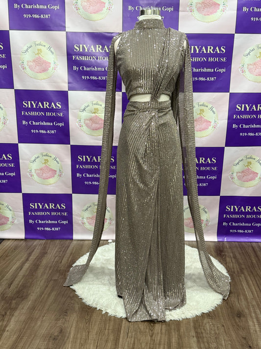 Beautiful Sequins party wear One minute saree. Huk and drape and it has a lovely cape hands. Available in size 38 ( Medium ) and  44 ( XXL )
