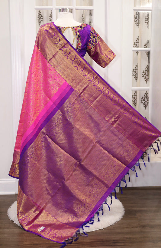 Elegance personified! 💖💜 Pure Kanjeevaram silk saree in Rani pink and Purple combo, certified with Silk Mark. Adorned with exquisite Maggam work blouse featuring Zardosi and knot work. Size 40 plus 3 in margin.