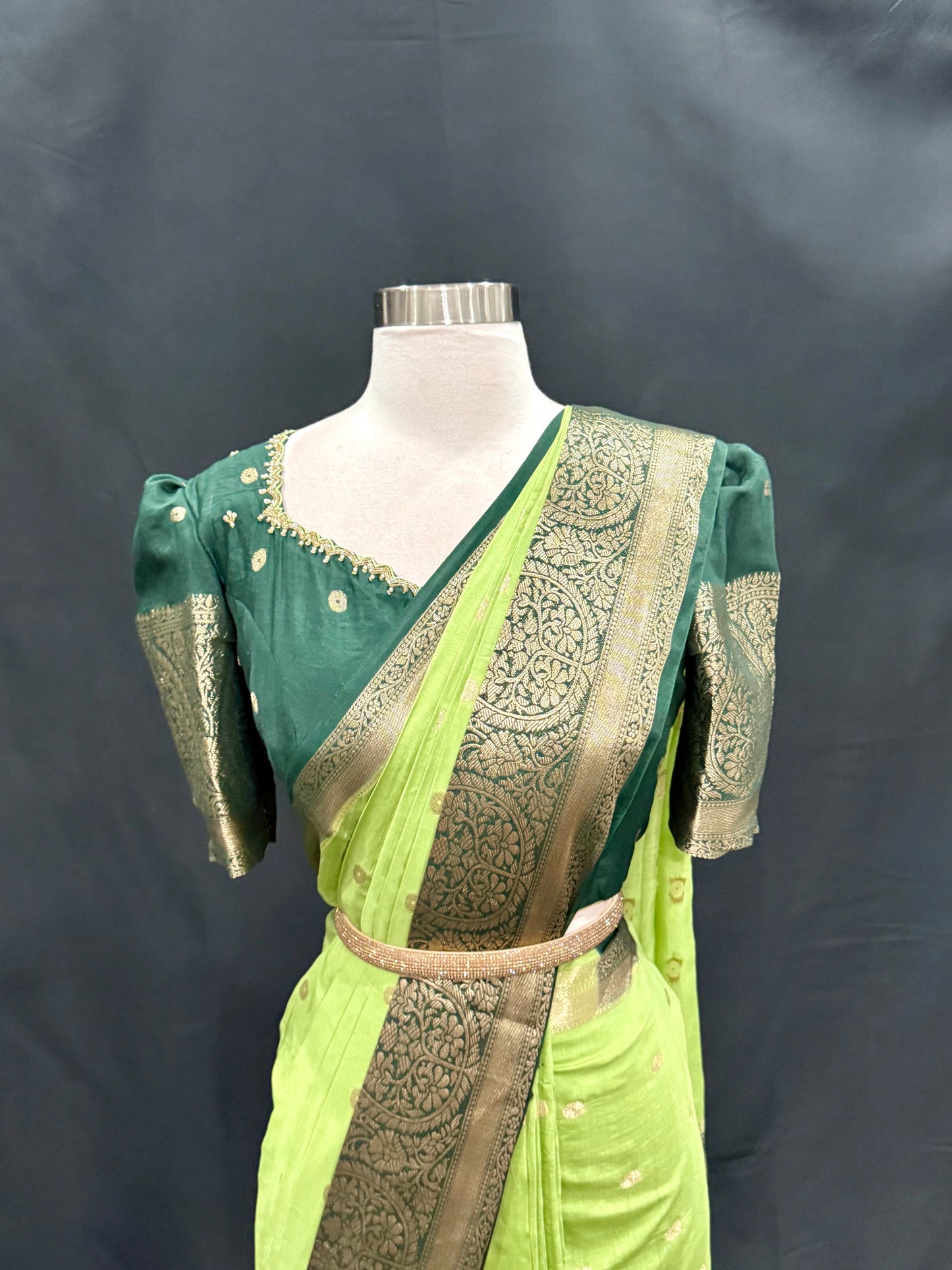 Stunning Green combo Raw Mango silk saree paired with a contrasting pink blouse and Hand work on the blouse. Size 38 upto 42.