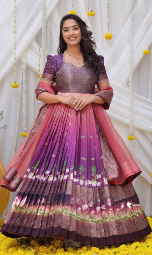 Beautiful Banarasi silk pichwai print Swarovski work long gown with matching dupatta.
Size small 36
Length: 54 in