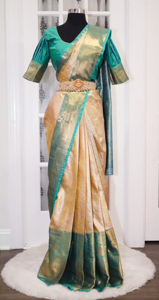 Beautiful kanchi pattu saree in green and gold combo with elegant with stitched blouse fits 38 to 44 in. For this festival season at a great price $135. Ready to ship.