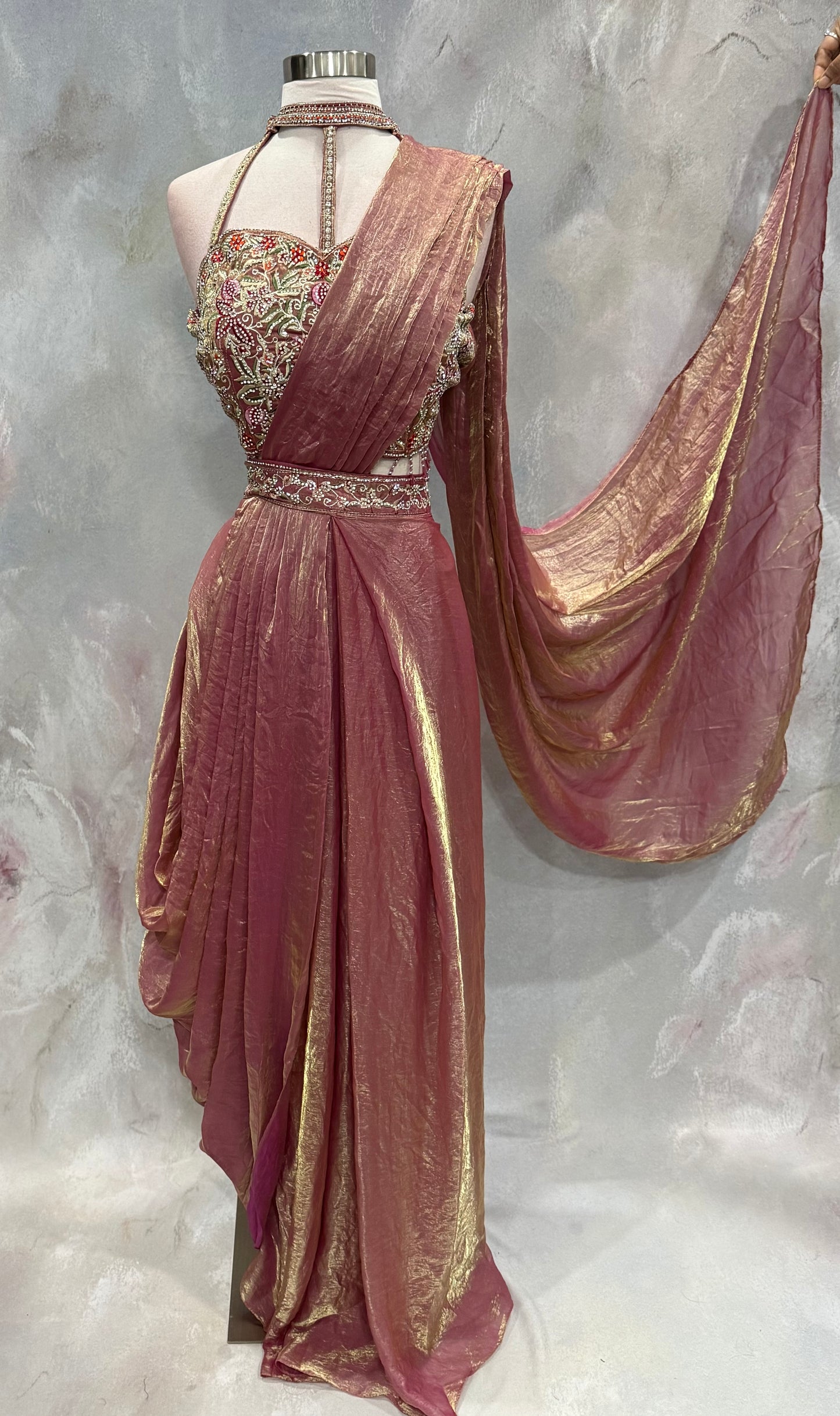 Stunning blush pink Indo-Western drape outfit featuring a beautifully embroidered tube-style blouse adorned with intricate stone, sequin, and zari work