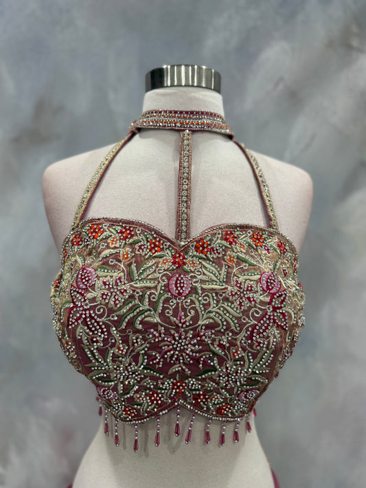 Stunning blush pink Indo-Western drape outfit featuring a beautifully embroidered tube-style blouse adorned with intricate stone, sequin, and zari work