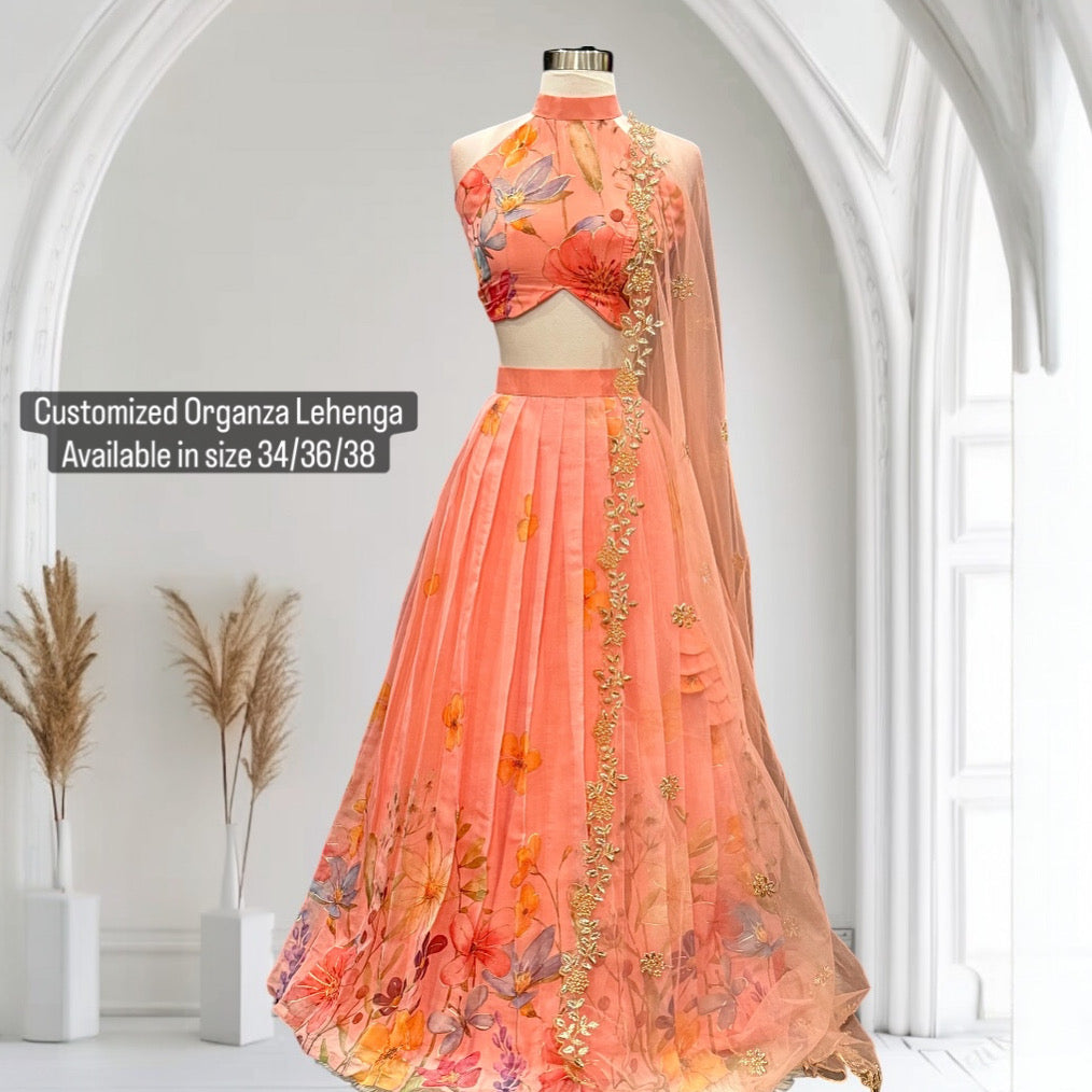 Step into elegance with this stunning peach floral lehenga set, perfect for festive occasions, weddings and receptions. Available in size 34/36/38.