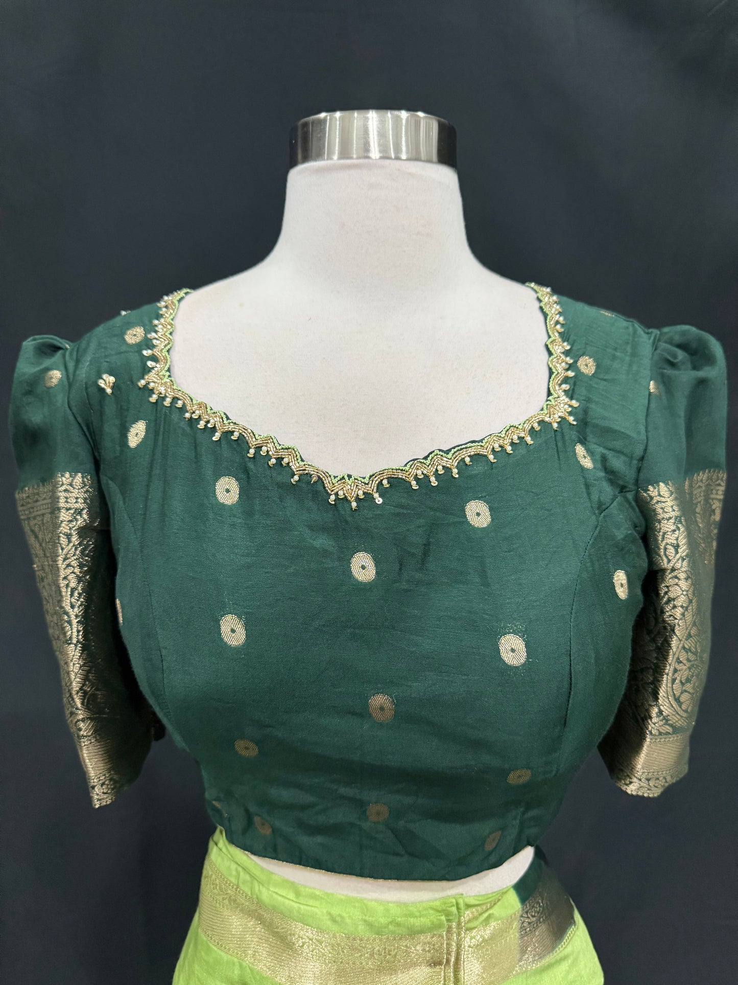 Stunning Green combo Raw Mango silk saree paired with a contrasting pink blouse and Hand work on the blouse. Size 38 upto 42.