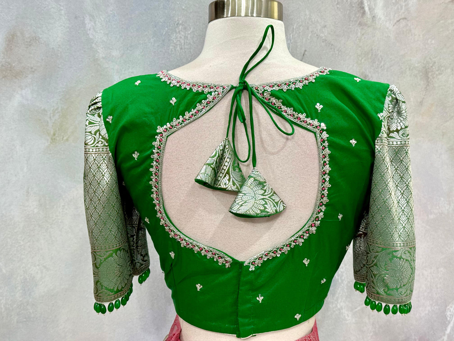 Beautiful Customized Banarasi silk half sarees in Green and bubble gum pink hues Maggam work blouses and bead embellishments size 34 to 36