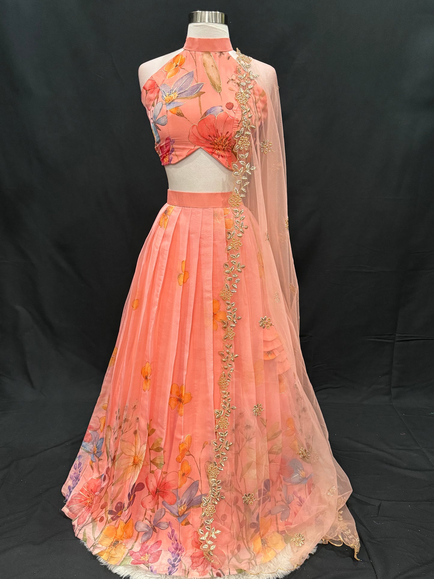 Step into elegance with this stunning peach floral lehenga set, perfect for festive occasions, weddings and receptions. Available in size 34/36/38.