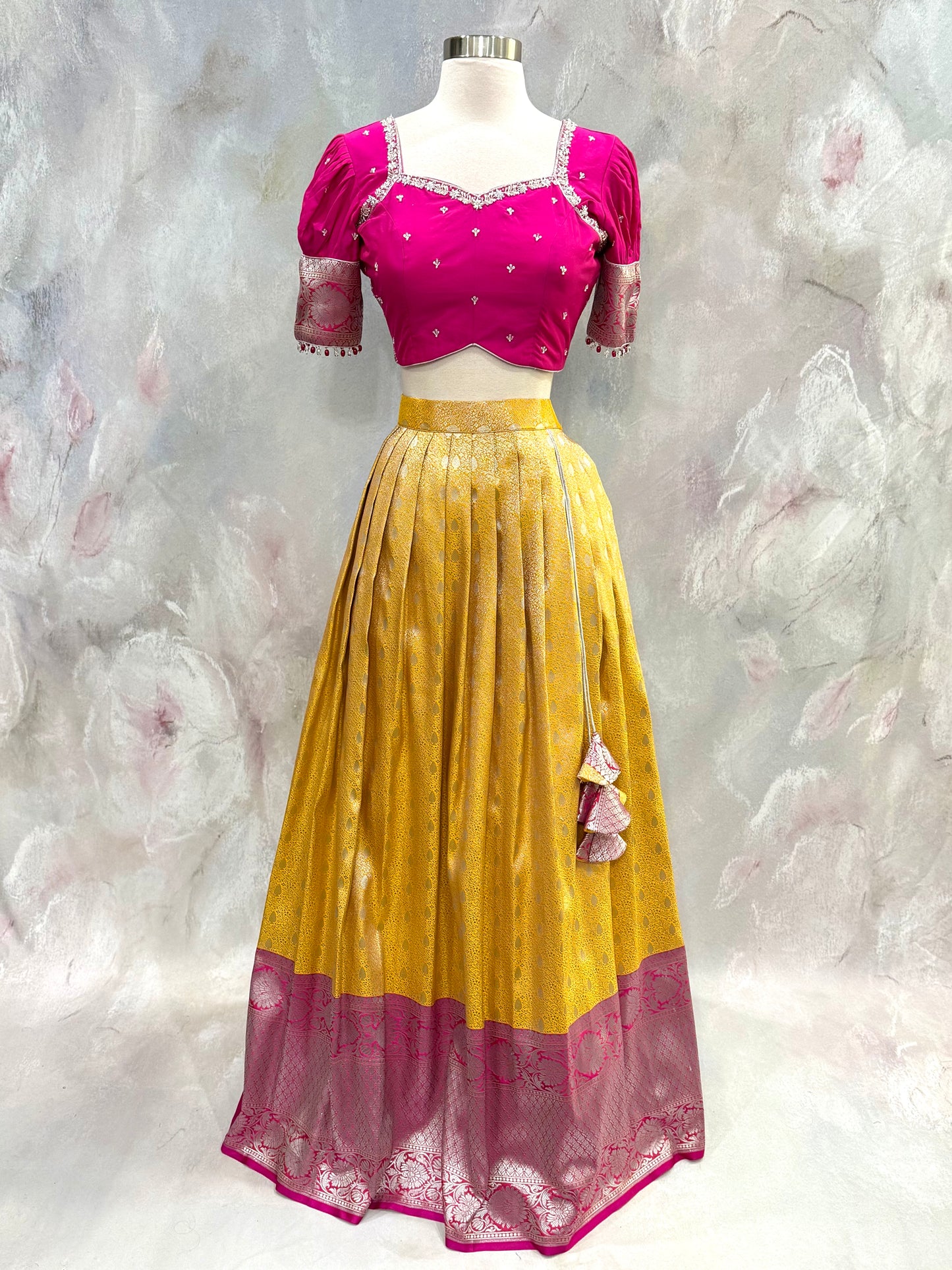Beautiful Customized Banarasi silk half sarees in yellow and magenta pink hues Maggam work blouses and bead embellishments size 34 to 38