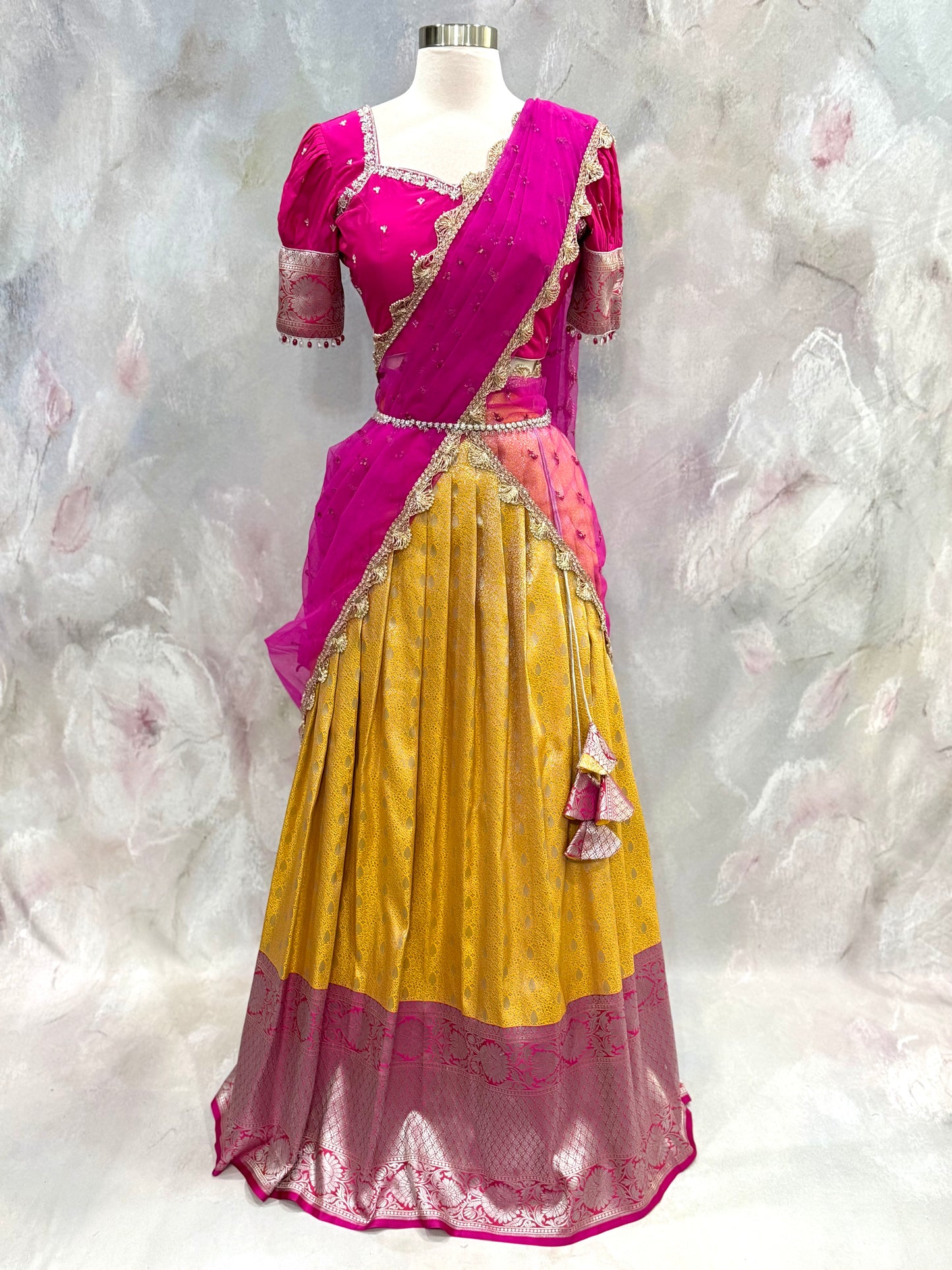 Beautiful Customized Banarasi silk half sarees in yellow and magenta pink hues Maggam work blouses and bead embellishments size 34 to 38