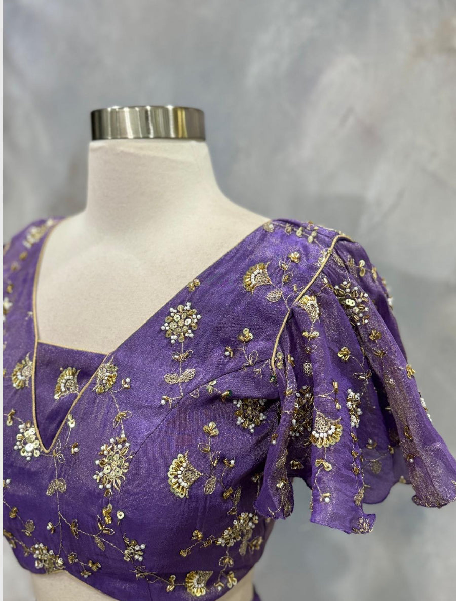 Custom elegance by Siyaras Fashion House. Size 36-38. This customized tissue crop top lehenga set from Siyaras Fashion House features a rich