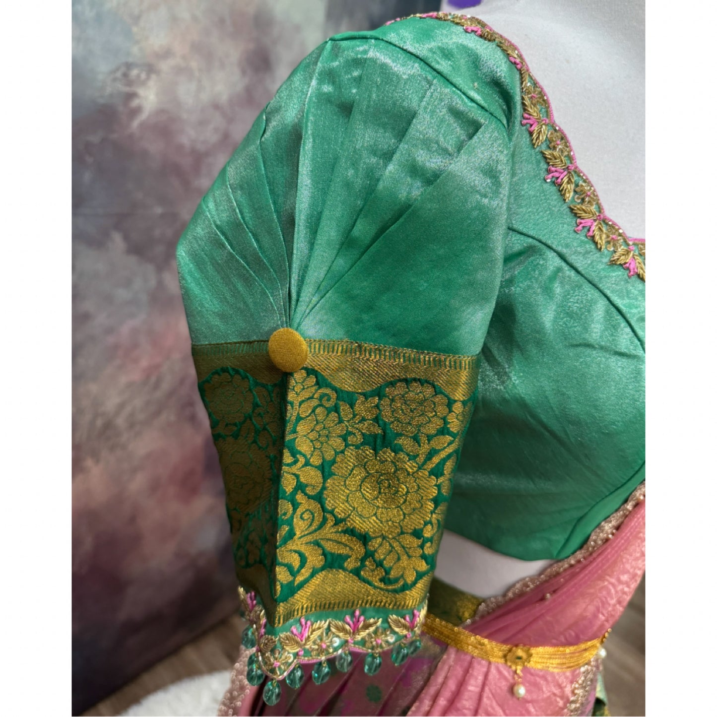 Kanchi Pattu half saree in shades of pinkgreen. Paired with a rich Maggam work designer blouse size is 36 to 40 its perfect for festive vie