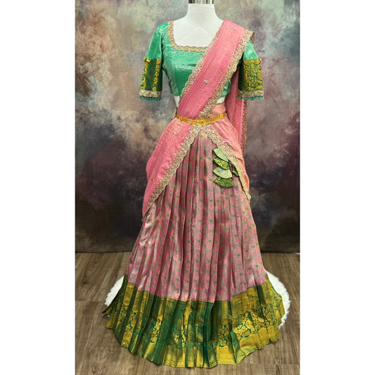 Kanchi Pattu half saree in shades of pinkgreen. Paired with a rich Maggam work designer blouse size is 36 to 40 its perfect for festive vie