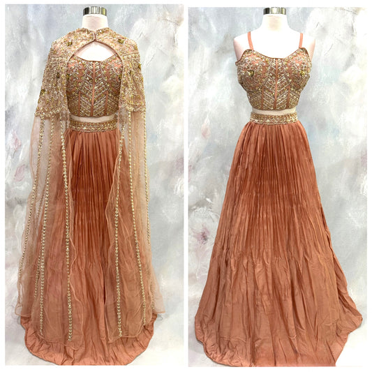 A beautiful Indo-Western Cape -style corset lehenga that blends timeless elegance with modern glamour.
Fits size 36 to 38.