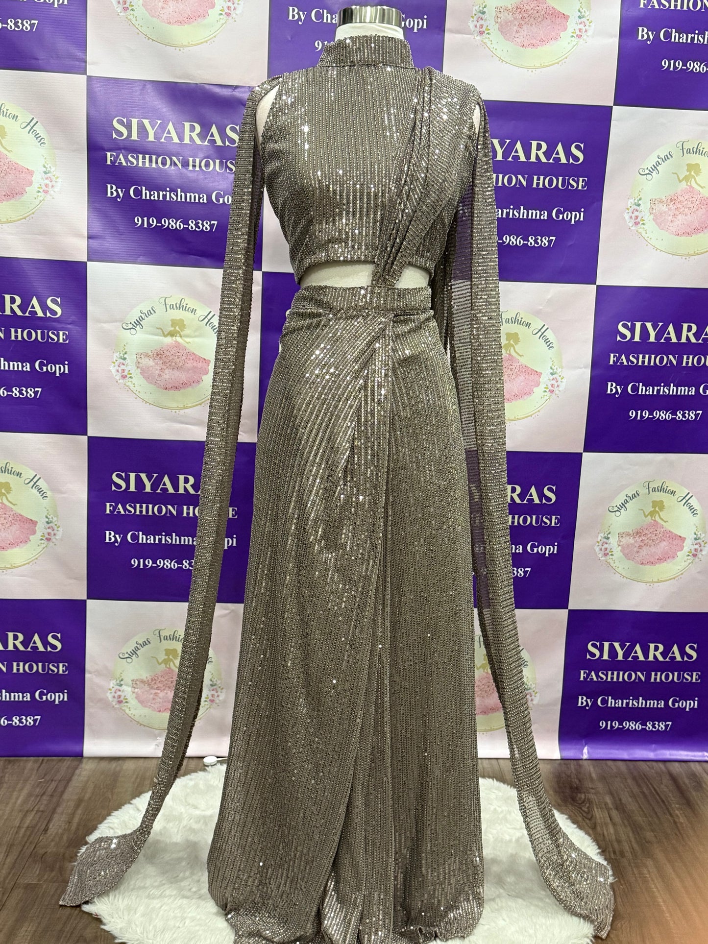 Beautiful Sequins party wear One minute saree. Huk and drape and it has a lovely cape hands. Available in size 38 ( Medium ) and  44 ( XXL )