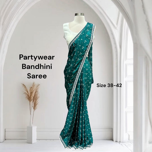 Beautiful Bhandini Partywear Saree perfect for any occasion. White blouse available in size 38 and 42.