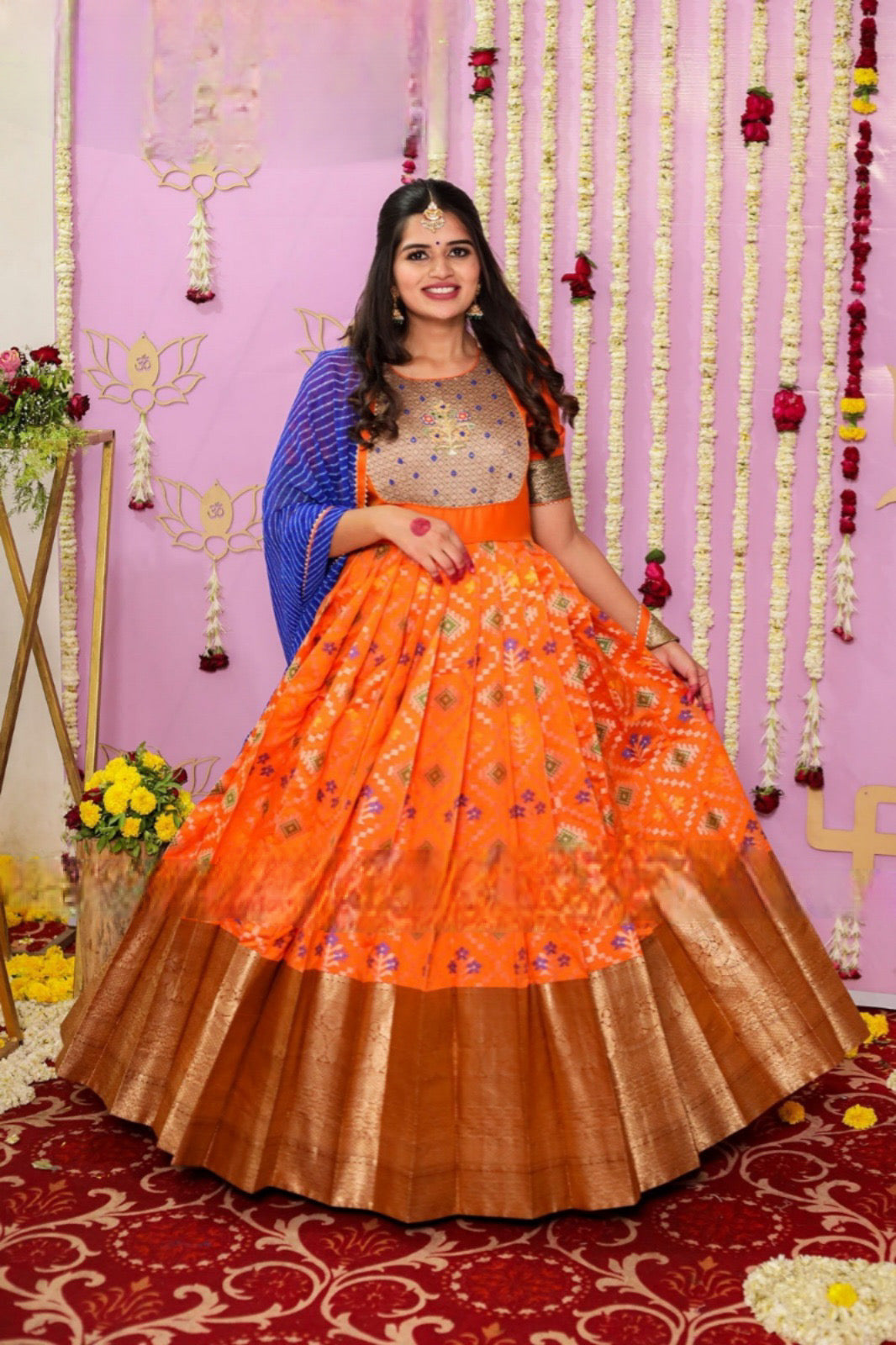 Festival Special Orange Color Pattu Gown with Blue Laheriya Style Dupatta