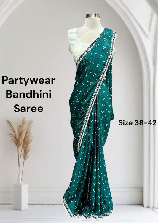 Beautiful Bhandini Partywear Saree perfect for any occasion. White blouse available in size 38 and 42.