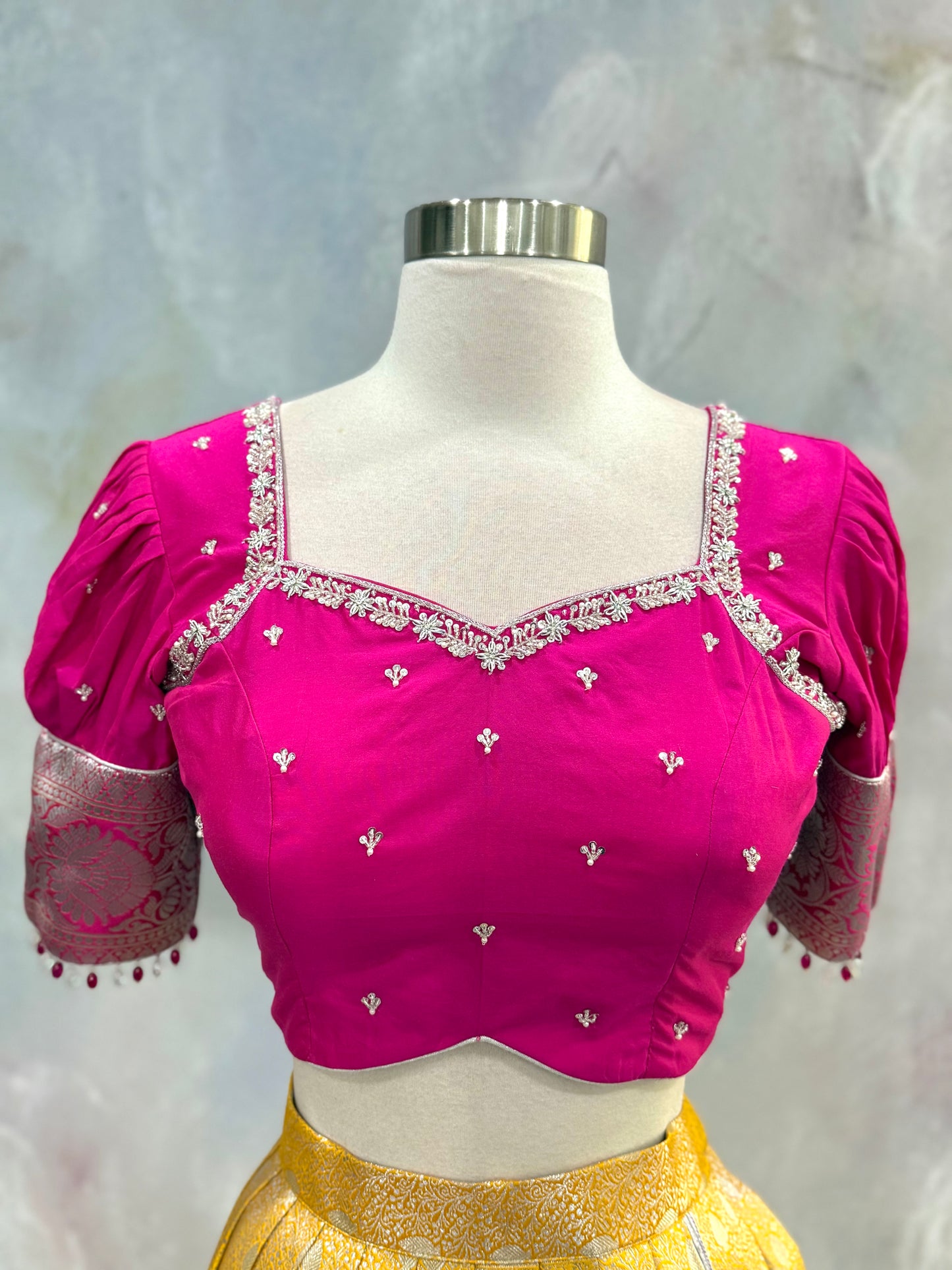Beautiful Customized Banarasi silk half sarees in yellow and magenta pink hues Maggam work blouses and bead embellishments size 34 to 38
