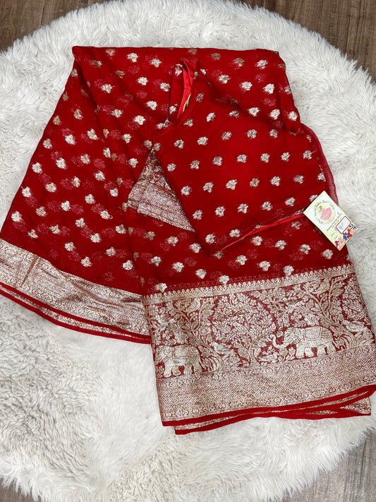 Beautiful gorgette red saree with stitched blouse. Available in size 36