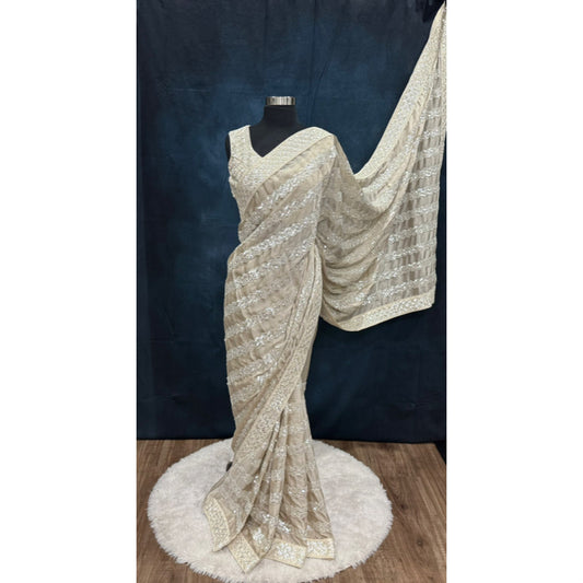 Beautiful party wear sequin saree in Almond color/ soft beige. Available in size 40 to 44