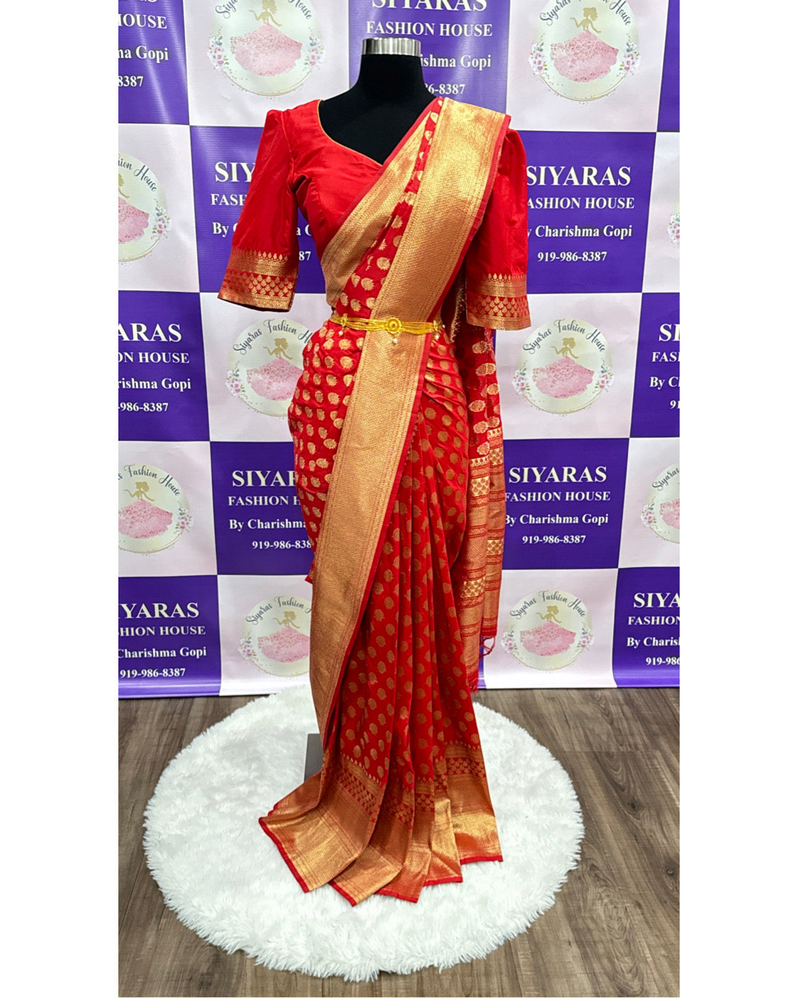 Fiery Red silk saree with elaborate zari work and comes with stitched Designer Blouse