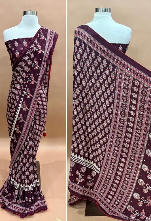 Gorgeous Ajrakh Silk Sarees with Mirror  Wine Maroon – Royal, graceful & sophisticated, adorned intricate cream and red patterns.✨ Beautiful mirror work🌸 Traditional Ajrakh-inspired prints💃 Elegant borders & stunning drapes