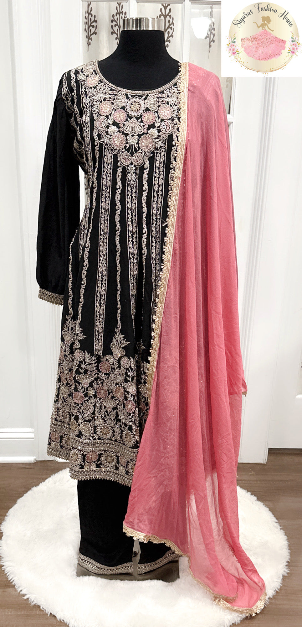Pakistani Anarkali Suit Set in a striking combination of dark green and pink with heavy embroidery work