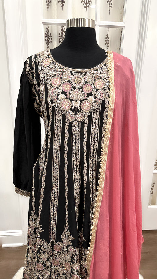 Pakistani Anarkali Suit Set in a striking combination of dark green and pink with heavy embroidery work