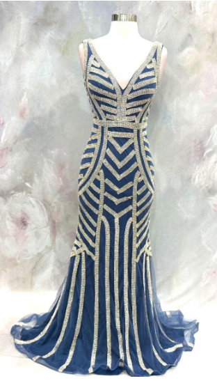 Elegant blue evening gown featuring stunning silver beaded stripe work throughout the dress. Size 32 waist 28