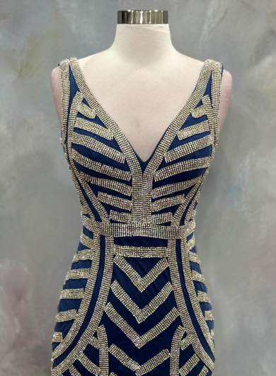 Elegant blue evening gown featuring stunning silver beaded stripe work throughout the dress. Size 32 waist 28