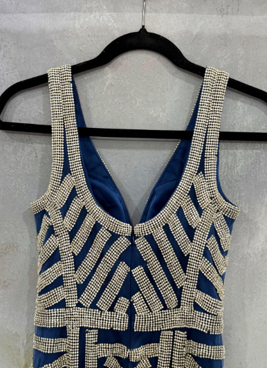 Elegant blue evening gown featuring stunning silver beaded stripe work throughout the dress. Size 32 waist 28