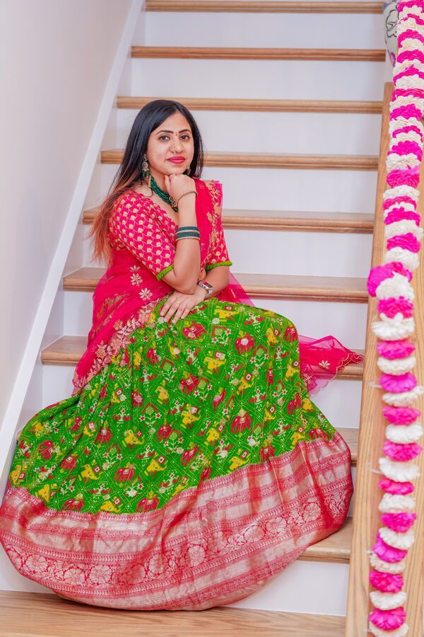 Elegant Parrot Green and Pink Ikkat Langa Voni Half Saree with Pattu Border and Trendy Stitched Blouse