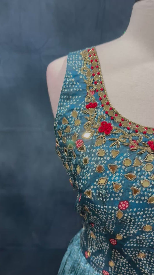 Beautiful Bandini party wear long gown with mirror and thread work on it. Available in size 44 inch