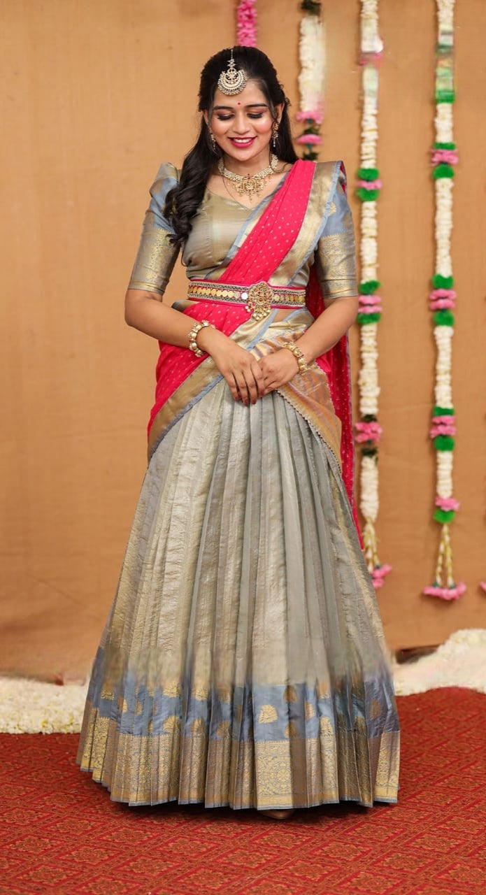 Silver Tomato Red Half Saree With Peacock Maggam worked waist Belt And a Beautiful Patter Blouse with Puff Sleeves