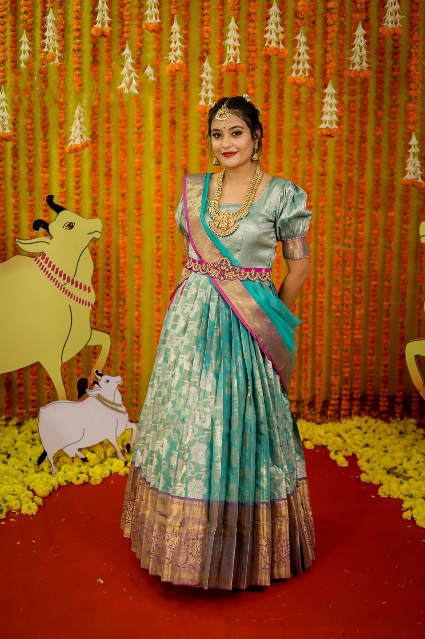 Turquoise Pattu Gown with Zari Border and Kundan work Waist belt