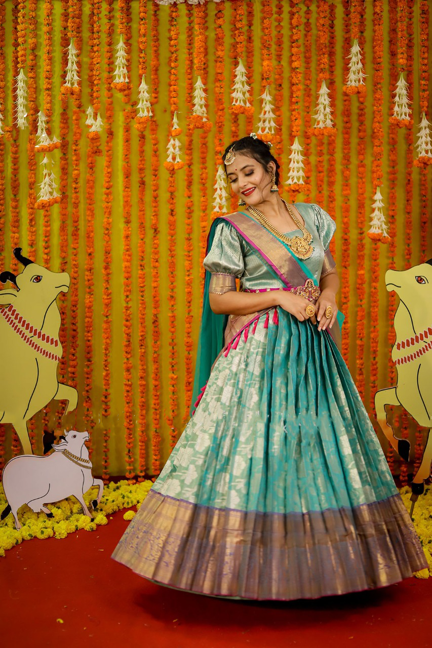 Turquoise Pattu Gown with Zari Border and Kundan work Waist belt