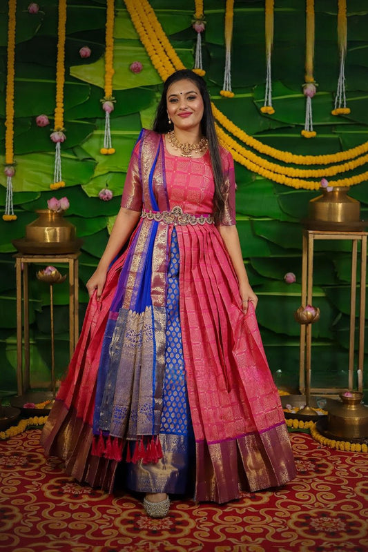 Traditional Pink Gown Pure Silk Fabric Accompanied With Crepe Lining And Zari border with Royal Pink Muggam worked Belt
